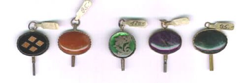 Some pocket watch keys with coloured stones